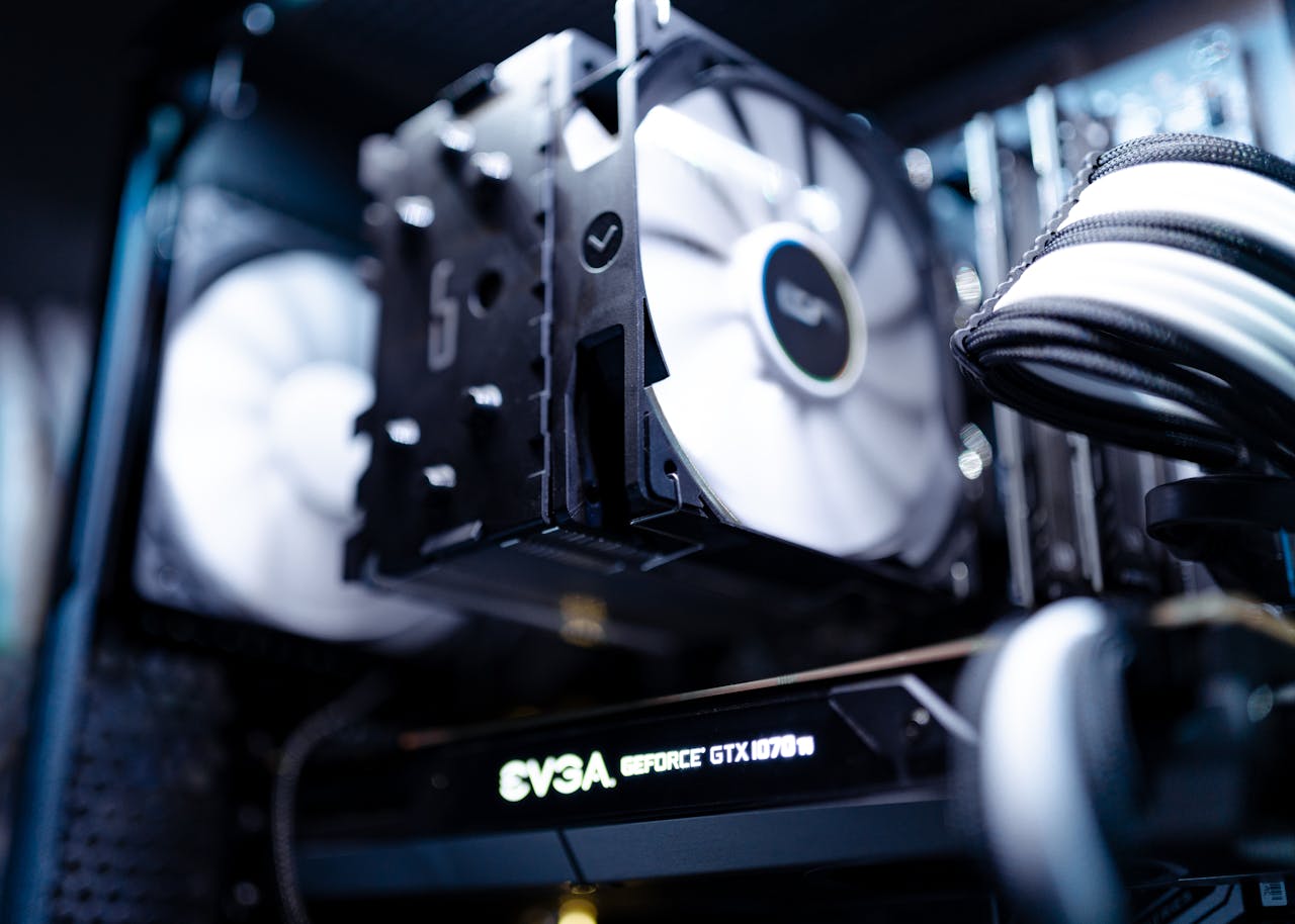 journey Detailed view of a cooling fan inside a modern gaming PC setup.